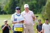 Justin Matthews, right, of Little Britain, Ont.,and caddie Braeden Cryderman of Bracebridge, Ont., talk about a shot from the rough on the eighth fairway during the Canadian Open in Caledon, Ont., on Thursday, June 11, 2026. THE CANADIAN PRESS/Nathan Denette