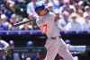 Chicago Cubs' Seiya Suzuki follows the flight of his grand slam off Colorado Rockies starting pitcher Ryan Feltner in the fourth inning of a baseball game Thursday, June 11, 2026, in Denver. (AP Photo/David Zalubowski)