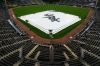 A tarp covers the infield during a rain delay before a baseball game between the Atlanta Braves and the Chicago White Sox in Chicago, Thursday, June 11, 2026. (AP Photo/Nam Y. Huh)