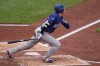 Los Angeles Dodgers' Shohei Ohtani (17) watches his solo home run off Pittsburgh Pirates pitcher Mitch Keller during the third inning of a baseball game in Pittsburgh, Thursday, June 11, 2026. (AP Photo/Gene J. Puskar)