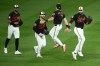 Baltimore Orioles' Jackson Holliday (7) celebrates with Colton Cowser, right, Taylor Ward, second from left, and Leody Taveras, left, after a baseball game against the Seattle Mariners, Thursday, June 11, 2026, in Baltimore. (AP Photo/Nick Wass)
