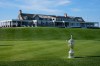 FILE - The U.S. Open Golf Championship trophy is displayed in front of the clubhouse at Shinnecock Hills Golf Club in Southampton, N.Y., Sept. 15, 2025. (AP Photo/Seth Wenig, File)