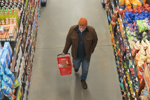 A customer shops at Vince’s Market, a grocery store in Sharon, Ontario, on Thursday Nov. 21, 2024. THE CANADIAN PRESS/Chris Young