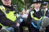 Protesters are detained by police outside Woolwich Crown Court, London, during a hearing where Palestine Action activists are due to be sentenced over a break-in at the UK base of an Israel-based defence firm, Elbit Systems site, in London, Friday June 12, 2026. (Yui Mok/PA via AP)