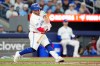 Toronto Blue Jays catcher Alejandro Kirk (30) hits an equalizer solo home run during ninth inning MLB baseball action against the Athletics, in Toronto on Saturday, March 28, 2026. THE CANADIAN PRESS/Frank Gunn