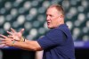 Milwaukee Brewers manager Pat Murphy confers with players as they warm up before a baseball game against the Colorado Rockies, Saturday, June 6, 2026, in Denver. (AP Photo/David Zalubowski)