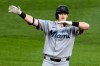 Miami Marlins' Owen Caissie celebrates as he stands on second base after driving in two runs with a double off Pittsburgh Pirates pitcher Wilber Dotel during the seventh inning of a baseball game in Pittsburgh, Friday, June 12, 2026. (AP Photo/Gene J. Puskar)