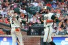 Baltimore Orioles' Colton Cowser, right, is greeted by Gunnar Henderson (2) after scoring on a sacrifice fly hit by Jackson Holliday off San Diego Padres pitcher Griffin Canning during the second inning of a baseball game, Friday, June 12, 2026, in Baltimore. (AP Photo/Terrance Williams)