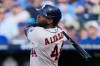 Houston Astros' Yordan Alvarez watches his grand slam during the first inning of a baseball game against the Kansas City Royals, Friday, June 12, 2026, in Kansas City, Mo. (AP Photo/Charlie Riedel)