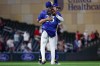 Minnesota Twins third baseman Brooks Lee and first baseman Royce Lewis celebrate their teams win against the St. Louis Cardinals during the ninth inning of a baseball game, Friday, June 12, 2026, in Minneapolis. (AP Photo/Matt Krohn)