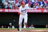 Los Angeles Angels' Trey Mancini starts to run after hitting a a two-run triple against the Tampa Bay Rays in the first inning of a baseball game Friday, June 12, 2026, in Anaheim, Calif. (AP Photo/Wally Skalij)