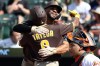 San Diego Padres' Samad Taylor hugs San Diego Padres' Xander Bogaerts after hitting a home run during the first inning of a baseball game against the Baltimore Orioles, Saturday, June 13, 2026, in Baltimore. (AP Photo/Daniel Kucin Jr.)