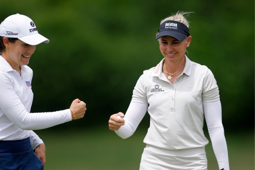 Ryann O'Toole, right, and Albane Valenzuela, left, celebrate on the 16th green during the first round of the Dow Championship LPGA golf tournament, Thursday, June 11, 2026, at Midland Country Club in Midland, Mich. (AP Photo/Al Goldis)