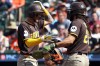 San Diego Padres center fielder Jackson Merrill celebrates with San Diego Padres second baseman Fernando Tatis Jr. after hitting a home run during the first inning of a baseball game against the Baltimore Orioles, Saturday, June 13, 2026, in Baltimore. (AP Photo/Daniel Kucin Jr.)