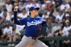 Los Angeles Dodgers pitcher Yoshinobu Yamamoto (18) delivers during the fifth inning of a baseball game against the Chicago White Sox, Saturday, June 13, 2026, in Chicago. (AP Photo/Matt Marton)