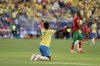 Brazil's Vinicius Junior (7) reacts after being tripped in the first half during the World Cup Group C soccer match between Brazil and Morocco in East Rutherford, N.J., near New York, Saturday, June 13, 2026. (AP Photo/Adam Hunger)