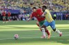 Brazil's Vinicius Junior (7) battles for posession against Morocco's Achraf Hakimi (2) in the first half during the World Cup Group C soccer match between Brazil and Morocco in East Rutherford, N.J., near New York, Saturday, June 13, 2026. (AP Photo/Adam Hunger)