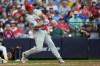Philadelphia Phillies' J.T. Realmuto hits a three-run home run during the sixth inning of a baseball game against the Milwaukee Brewers, Saturday, June 13, 2026, in Milwaukee. (AP Photo/Aaron Gash)