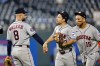 Houston Astros' Christian Walker (8) Jose Altuve, center, and Isaac Paredes (15) celebrate at the end of a baseball game against the Kansas City Royals in Kansas City, Mo., Saturday, June 13, 2026. (AP Photo/Colin E. Braley)