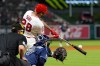 Los Angeles Angels' Jose Siri, center, hits a two-run home run as Tampa Bay Rays catcher Hunter Feduccia, right, and home plate umpire Dave Rackley watch during the seventh inning of a baseball game Saturday, June 13, 2026, in Anaheim, Calif. (AP Photo/Mark J. Terrill)