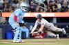 New York Yankees left-fielder Max Schuemann scores in front of Blue Jays catcher Alejandro Kirk in Toronto on Sunday June 14, 2026. THE CANADIAN PRESS/Chris Young
