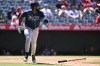 Tampa Bay Rays' Junior Caminero watches his home run during the eighth inning of a baseball game against the Los Angeles Angels, Sunday, June 14, 2026, in Anaheim, Calif. (AP Photo/William Liang)