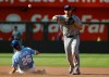 Kansas City Royals' Kameron Misner (26) is out at second base as Texas Rangers shortstop Corey Seager, right, throws to first base for a double play during the seventh inning of a baseball game in Kansas City, Mo., Thursday, June 11, 2026. (AP Photo/Colin E. Braley)