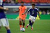 Netherlands' Memphis Depay, left, and Japan's Kaishu Sano fight for the ball during the World Cup Group F soccer match between the Netherlands and Japan in Arlington, Texas, near Dallas, Sunday, June 14, 2026. (AP Photo/Tony Guttierez)
