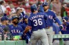Texas Rangers designated hitter Wyatt Langford (36) celebrates after his home run during the first inning of a baseball game against the Boston Red Sox, Sunday, June 14, 2026, in Boston. (AP Photo/Mark Stockwell)