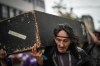 Carl Gladue helps carry an empty coffin during a march organized by the Vancouver Area Network of Drug Users (VANDU) to mark International Overdose Awareness Day in Vancouver on Thursday, Aug. 31, 2023. THE CANADIAN PRESS/Darryl Dyck