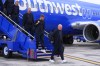 Czechia men's national soccer team head coach Miroslav Koubek, right, arrives with his team at Dallas Love Field Airport, Friday, June 5, 2026, in Dallas, ahead of the World Cup soccer tournament. (AP Photo/Julio Cortez)