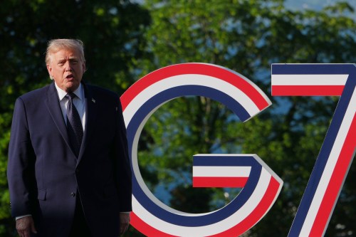 U.S. President Donald Trump talks talks as he greets France's President Emmanuel Macron and first lady Brigitte Macron at the G7 summit, Monday, June 15, 2026, in Evian-les-Bains, France. (AP Photo/Julia Demaree Nikhinson)