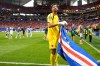 Cape Verde goalkeeper Vozinha celebrates as holds the flag of his country after the World Cup Group H soccer match between Spain and Cape Verde in Atlanta, Monday, June 15, 2026. (AP Photo/Mike Stewart)