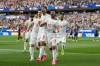 Iran's Ramin Rezaeian (23) celebrates with his teammates after scoring a goal during the World Cup Group G soccer match between Iran and New Zealand in Inglewood, Calif., near Los Angeles, Monday, June 15, 2026. (AP Photo/Andre Penner)