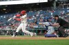 Washington Nationals' Luis García Jr., left, hits a single off Kansas City Royals pitcher Mitch Spence which scored Keibert Ruiz and Nasim Nuñez during the fifth inning of a baseball game, Monday, June 15, 2026, in Washington. (AP Photo/Terrance Williams)