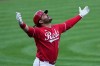 Cincinnati Reds' Eugenio Suárez celebrates after hitting a two-run homer during the first inning of a baseball game against the New York Mets in Cincinnati, Monday, June 15, 2026. (AP Photo/Carolyn Kaster)