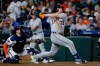 Detroit Tigers' Colt Keith (33) watches his second two-run home run of a baseball game in front of Houston Astros catcher Christian Vazquez, left, during the seventh inning Monday, June 15, 2026, in Houston. (AP Photo/Michael Wyke)