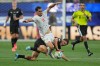 Iran's Ali Alipour (11) battles for the ball with New Zealand's Ryan Thomas (23) during the World Cup Group G soccer match between Iran and New Zealand in Inglewood, Calif., near Los Angeles, Monday, June 15, 2026. (AP Photo/Andre Penner)
