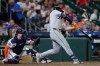 Detroit Tiger' Colt Keith, right, connects for a two-run home run in front of Houston Astros catcher Christian Vazquez, left, during the third inning of a baseball game Monday, June 15, 2026, in Houston. (AP Photo/Michael Wyke)