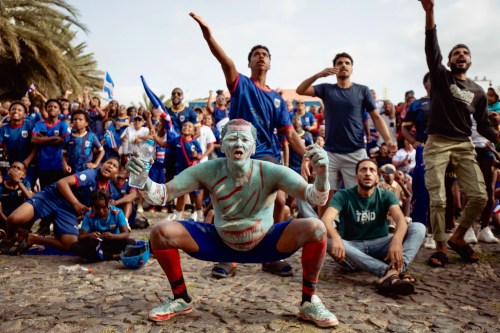 Fans react as they watch the World Cup Group H soccer match between Cape Verde and Spain at a viewing center in Mindelo, São Vicente, Cape Verde, Monday, June 15, 2026. (AP Photo/Queila Fernandes)