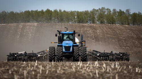 David Reid drives a seeding rig as he plants a wheat crop on the family farm near Cremona, Alta., Tuesday, May 6, 2025. THE CANADIAN PRESS/Jeff McIntosh