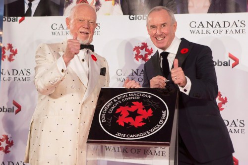 Don Cherry, left, and Ron MacLean pose with their plaque as they are inducted into Canada's Walk of Fame during an event in Toronto on Saturday, November 7, 2015. THE CANADIAN PRESS/Chris Young