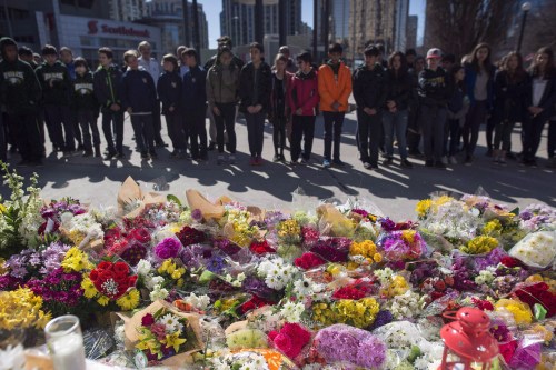 Flowers line a memorial at Mel Lastman Square in Toronto on Thursday, April 26, 2018 for the victims of a deadly van attack. THE CANADIAN PRESS/Cole Burston
