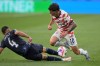 Paraguay's Juan Jose Caceres (4) tackles United States' Christian Pulisic (10) during the World Cup Group D soccer match in Inglewood, Calif., near Los Angeles, Friday, June 12, 2026. (AP Photo/Jayne Kamin-Oncea)