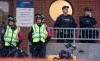 Police watch over Anti police brutality protesters outside Montreal police station 39 in Montreal North during an anti police brutality protest on Monday June 15, 2026. THE CANADIAN PRESS/Peter McCabe