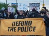Anti police brutality protesters march outside Montreal police station 39 in Montreal North during an anti police brutality protest on Monday June 15, 2026. THE CANADIAN PRESS/Peter McCabe