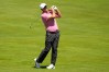 Brooks Koepka hits from the fairway on the 13th hole during a practice round for the U.S. Open golf tournament at Shinnecock Hills Golf Club in Southampton, N.Y., Tuesday, June 16, 2026.(AP Photo/Gerald Herbert)