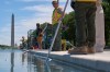Members of the National Park Service clean the Lincoln Memorial Reflecting Pool of algae, Tuesday, June 16, 2026, in Washington. (AP Photo/Jacquelyn Martin)