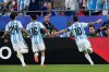 Argentina's Lionel Messi, right, celebrates after scoring his team's first goal during the World Cup Group J soccer match between Argentina and Algeria in Kansas City, Mo., Tuesday, June 16, 2026. (AP Photo/Charlie Riedel)