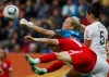 FILE -New Zealand goalkeeper Jenny Bindon deflects a ball as she is challenged by England's Alex Scott, front, during the group B match between New Zealand and England at the Women's Soccer World Cup in Dresden, Germany, Friday, July 1, 2011. (AP Photo/Petr David Josek, File)